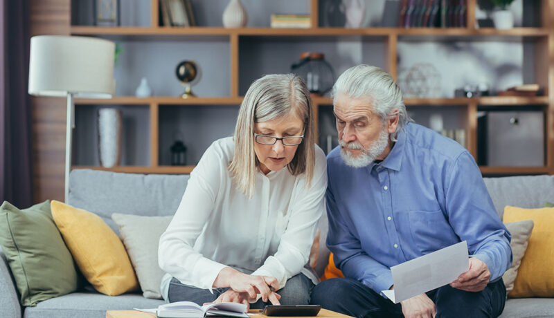Senior Couple Examining How Do You Do a Budget for Senior Living